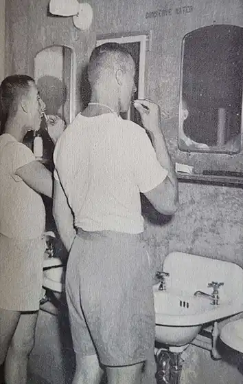 Marines at Camp Lejeune brushing their teeth and shaving.